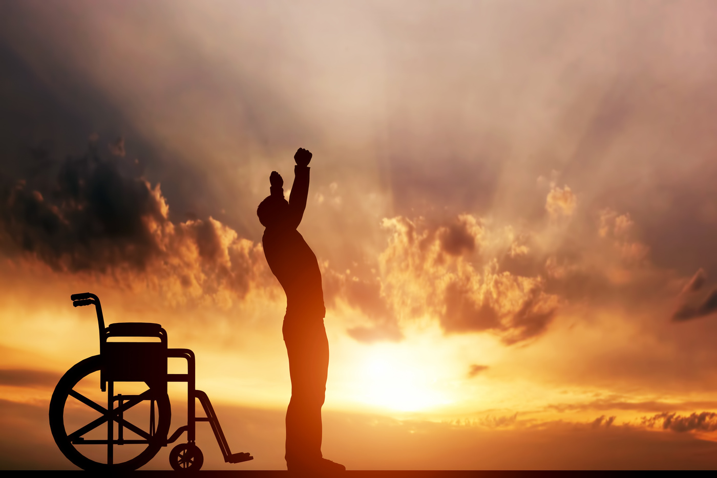 A Disabled Man Standing up from Wheelchair